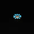Detailed close-up of blue daisy alloy DIY charm with golden center for craft decoration. - Sky Blue