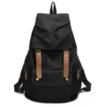 Black canvas backpack for school and travel in black with brown leather straps and large capacity - Black