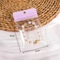 Bolsa transparente DIY para joyas con pulsera de perlas embalaje de almacenamiento lindo - 10 unidades/Paquete / Morado (#08)