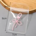 Sachet refermable transparent en PP avec porte-clés nœud rose, sachet de rangement à bijoux. - Modèle #03 / 7x11cm