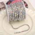 Colorful rhinestone chain close-up on plate, perfect for DIY phone case and nail art. - AB Iridescent (SS18) / 4mm (1m Pack) / Silver Base