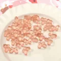 Transparante roze vlinder vorm glas kralen voor DIY sieraden maken en handwerk projecten. - 14x10mm (10 Stuks/Verpakking) / Oranje