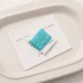 Light blue jade cord for DIY handmade bracelets, tightly wound on a neat plastic card. - 0.8mm 5m/Card / Peacock Blue