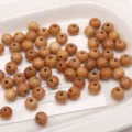 Naturholzperlen 10mm runde lose Holzperlen für DIY handgemachte Schmuckherstellung und Zubehör - Pfirsichholz-Stil