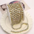 Gold claw chain rhinestones roll for DIY phone cases and nail art accessories decor. - White Rhinestone (SS28) / 6mm (1 Meter Pack) / Gold Base