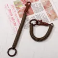 Brown coil spring lanyard keychain, elastic stretch cord with lobster clasp and ring. - 1 Piece / Brown