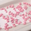 Pink glass rice beads 4x7mm, opaque cream finish DIY bracelet jewelry making accessories. - 52 Pieces/Pack / Deep Pink