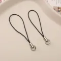 Black phone strap DIY jewelry accessory with metal ring, simple design for mobile charm. - Black
