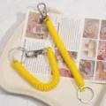 Yellow coil spring keychain, durable anti-lost lanyard for keys, bags, and phone charms. - Yellow