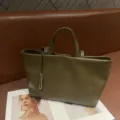Olive green leather tote bag detail, minimalist soft cowhide shoulder bag for women style. - Yucca Green