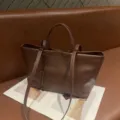Brown leather tote bag detail view, soft cowhide material, retro style shoulder handbag. - Baroque Brown