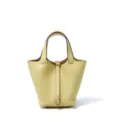 Gele lederen emmertas voor dames, klassieke handtas met metalen slot en handvat eraan. - L18 B13 H18 cm / Geel kuikentje met gouden sluiting