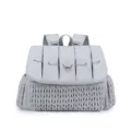 Grey quilted diaper backpack with woven front pocket, stylish and functional travel bag. - Gray