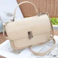 Elegant beige leather crossbody bag with top handle and silver hardware for women. - Apricot