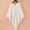 Close-up details of the white knitted poncho featuring elegant tassels and textured geometric pattern. - 2# White