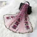 Detail view of French vintage floral embroidered mesh scarf with elegant lace trim and soft fabric. - Hot Pink