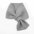 Detail of gray knitted bow scarf, short cross winter neck warmer knitwear texture close-up. - 79cm / Gray