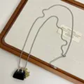Long sweater necklace featuring a black handbag and grape pendant, niche design jewelry. - Obsidian Texture Style (Z-3855)