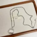Stylish metal handbag pendant layered necklace with black cord and silver chain for women. - Silver Bag Rope Necklace Style (Z-4551)
