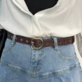 Brown heart cutout leather belt with gold metal buckle, stylish accessory for casual jeans. - Coffee