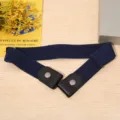 Detail view of navy blue invisible elastic waist belt with leather ends and metal snap buttons. - Navy Blue