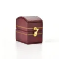 Vintage red leatherette mini ring box with gold clasp, perfect for jewelry storage. - Treasure Chest Antique Ring Box / Red