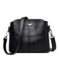 Black leather crossbody bag for women, stylish shoulder handbag with metal kangaroo logo. - Black