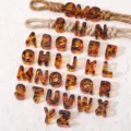Acrylic tortoiseshell letter beads A-Z with braided lanyards for DIY phone charms and crafts. - Letter A / 1 Piece/Pack / Amber Brown