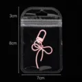 Transparent self-sealing bag containing a cute pink bow keychain for jewelry storage bag. - Outer 7x11cm Inner 6x8cm (50 Pieces/Pack) / Clear