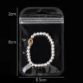 Clear self-sealing plastic jewelry storage packaging bag with pearl bracelet 8.5x8cm. - Outer 8.5x11cm Inner 7.5x8cm (50 Pieces/Pack) / Clear