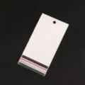 Detailopname van doorzichtige OPP-zak met witte kop, ideaal voor sieradenverpakking. - 7x14cm (100 Stuks/Verpakking)
