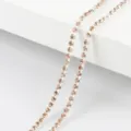 Sparkling rhinestone chain close-up, silver claw setting with champagne crystals for DIY jewelry. - Silver Base Champagne / 2mm (1 Meter)