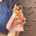 Niedlicher flüssiger Süßigkeitenhaus Schlüsselanhänger Glocken Anhänger Trend Tasche Deko - OPP-Beutel / Rosa