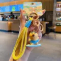 Cute capybara surfing keychain with yellow lanyard, fun cartoon bag charm accessory for students. - Surfing Capybara / OPP Bag Packaging