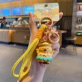 Cute capybara keychain with yellow strap and island theme packaging card for backpack charm accessory. - Maraca Capybara / OPP Bag Packaging