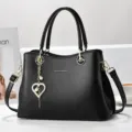 Black designer shoulder bag for women, stylish large capacity handbag with pearl heart. - Black