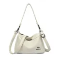 Stijlvolle lederen schoudertas voor dames, veelzijdige crossbody tas met verstelbare riem en ketting. - Broken Wit