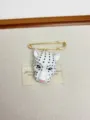 Detailed shot of retro white enamel leopard head brooch pin, vintage jewelry accessory. - Leopard Head Brooch (XZ0093) / White