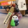 Cute resin wood-carving style panda keychain with bamboo shoot pendant, durable metal clasp. - Bamboo Shoot