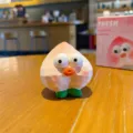 Cute resin peach fruit figurine toy, cartoon big eyes desktop ornament, lovely car interior decor. - Peach Figurine