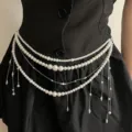 Close-up detail of multi-layer pearl waist chain with hanging tassels and metallic links. - Style D (Z-4142)