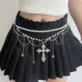 Close-up detail of the layered pearl and chain waist belt featuring a gothic cross pendant. - Style E (Z-3300)