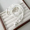 Detail view of white leather cord waist chain with elegant pearl accents and knots. - Leather Cord Pearl Waist Chain (Z-2049) / White