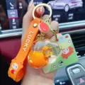 Lindo llavero naranja de arena líquida para llaves de coche y bolso accesorio elegante. - Naranja