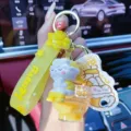 Süsser gelber Hase WC Ölfüllung Schlüsselanhänger, kreativer Auto Schlüsselanhänger Charm - Hase auf Toilette Flüssigkeit Schlüsselanhänger / OPP-Beutel / Gelb