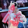 Süßer rosa Kaninchen Flüssigkeits Schlüsselanhänger mit Silikonband für Autoschlüssel. - Hase auf Toilette Flüssigkeit Schlüsselanhänger / OPP-Beutel / Rot