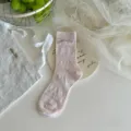 Pink mid-calf socks with delicate mesh pattern and cute silver bow accent for sweet style. - One Size / Light Pink