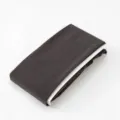 Leggings leotardos de mujer gris oscuro doblados ordenadamente con cartón blanco, cómodos. - Talla única / Gris oscuro