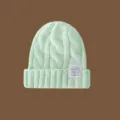 Gorro de punto verde menta para mujer y hombre, gorro de invierno cálido de ochos con etiqueta elegante. - Verde claro