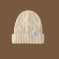 Gorro de punto liso para mujer y hombre, gorro de invierno cálido de punto trenzado con etiqueta. - Caqui